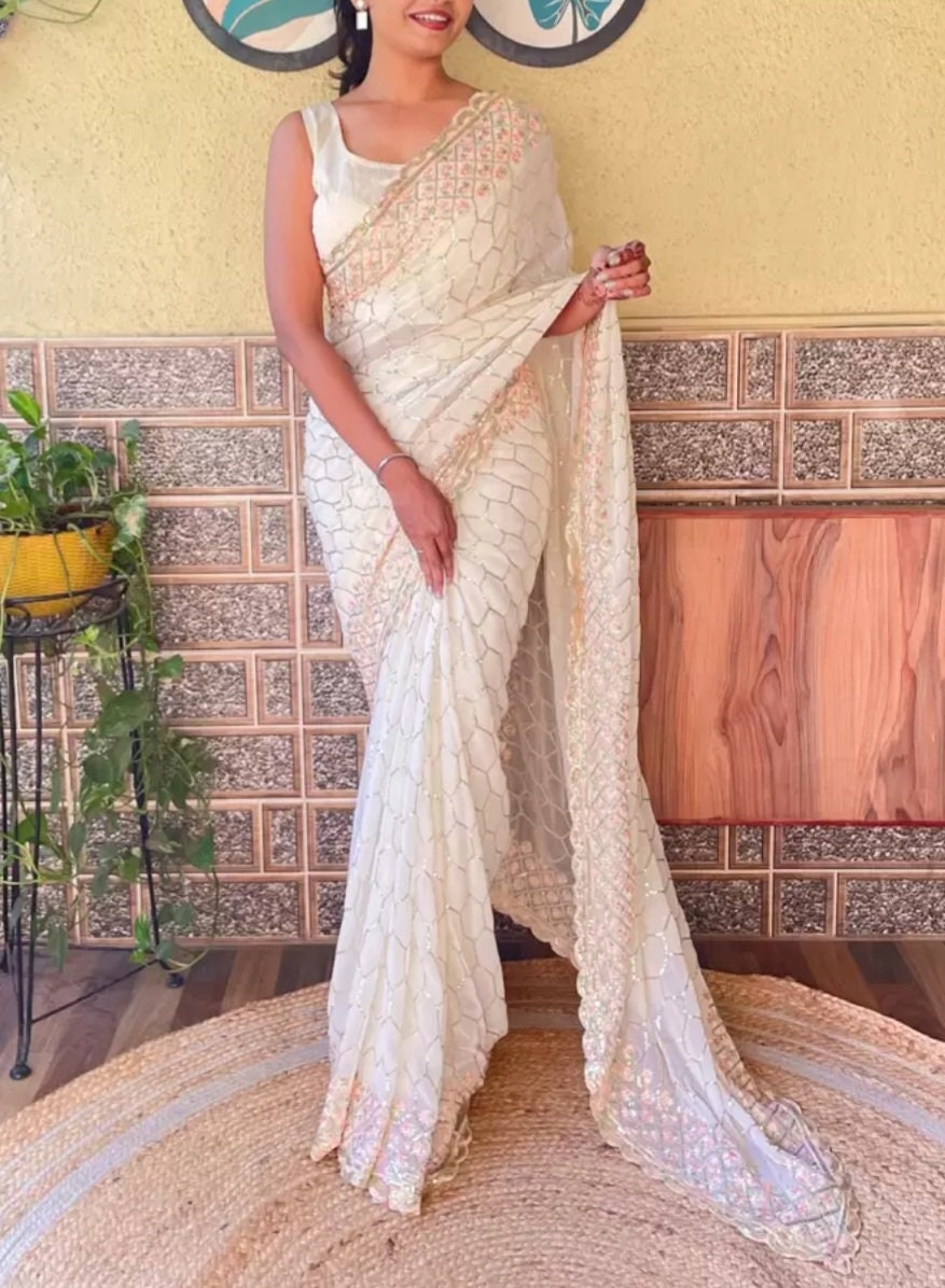 Off White Embellished Sequined Poly Georgette Saree with Detailed Border Ideal for Wedding Wear Pooja Wear Festive Occasions