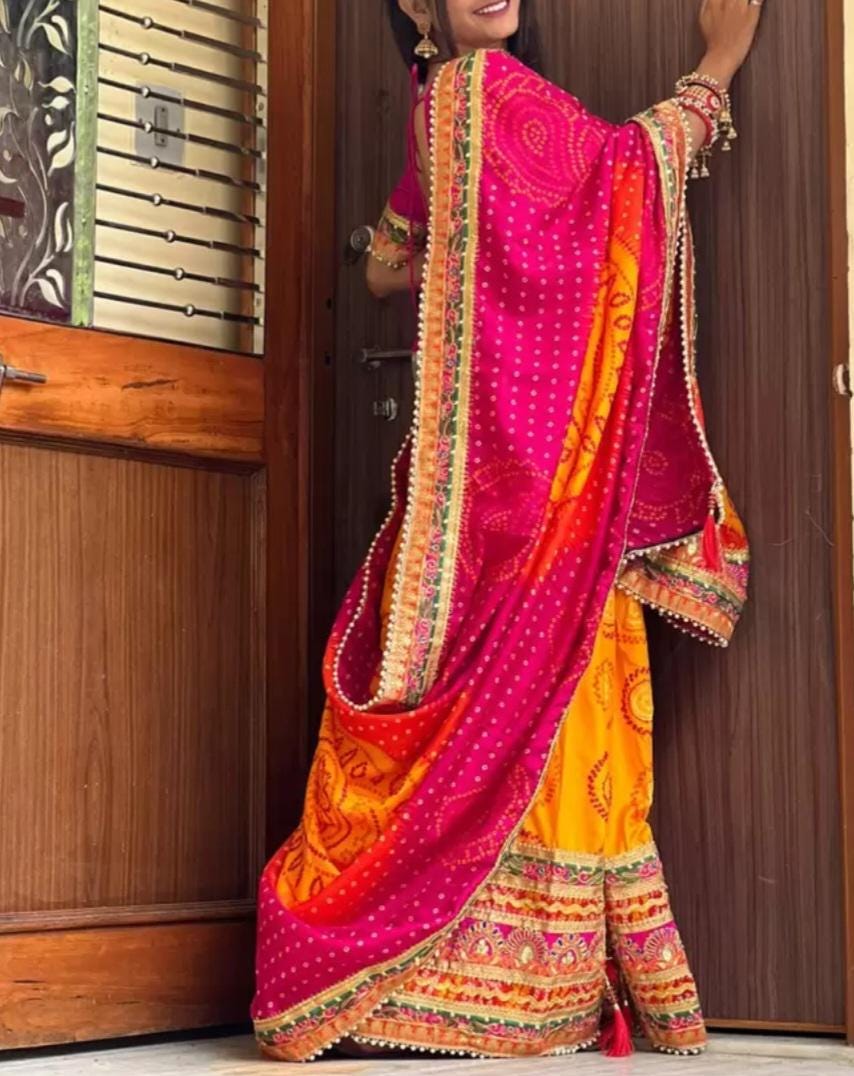 Orange and Pink Printed & Embroidered Pure Chiffon Bandhani Saree, with embroidered border, FREE Matching Petticoat.
