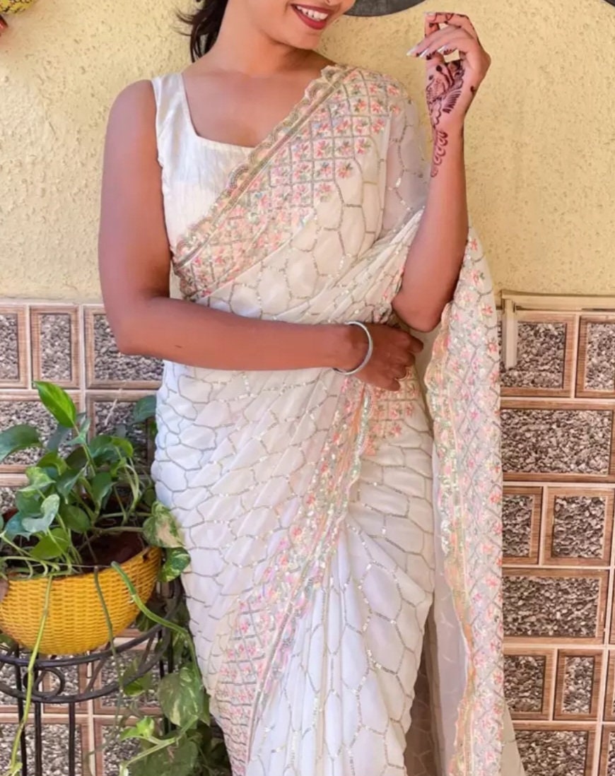 Off White Embellished Sequined Poly Georgette Saree with Detailed Border Ideal for Wedding Wear Pooja Wear Festive Occasions