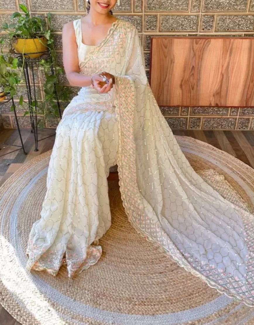 Off White Embellished Sequined Poly Georgette Saree with Detailed Border Ideal for Wedding Wear Pooja Wear Festive Occasions